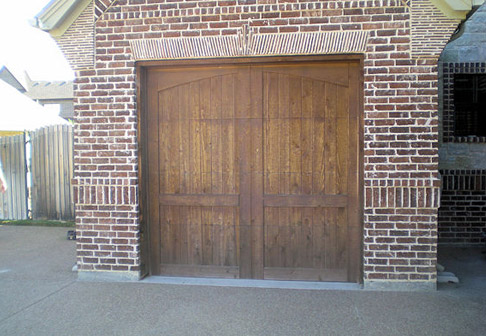 Unpainted wooden garage doors