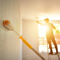 a painter painting a home