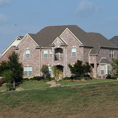 Exterior of brick home in Anna by Platinum Painting