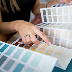 a person selecting a paint color for their project