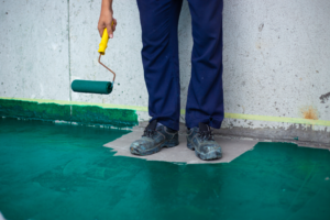 an inexperienced painter painting the floor