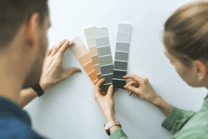 a person choosing a paint color for an accent wall
