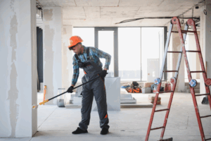 a person painting a commercial building