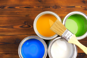 an assortment of paint cans